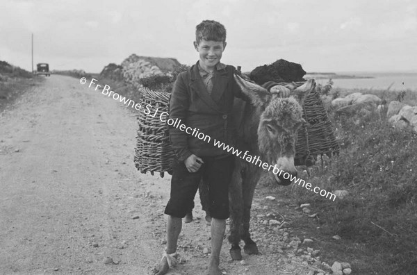 GAELTACHT INDUSTRIES  BOY WITH DONKEY CARRYING TURF